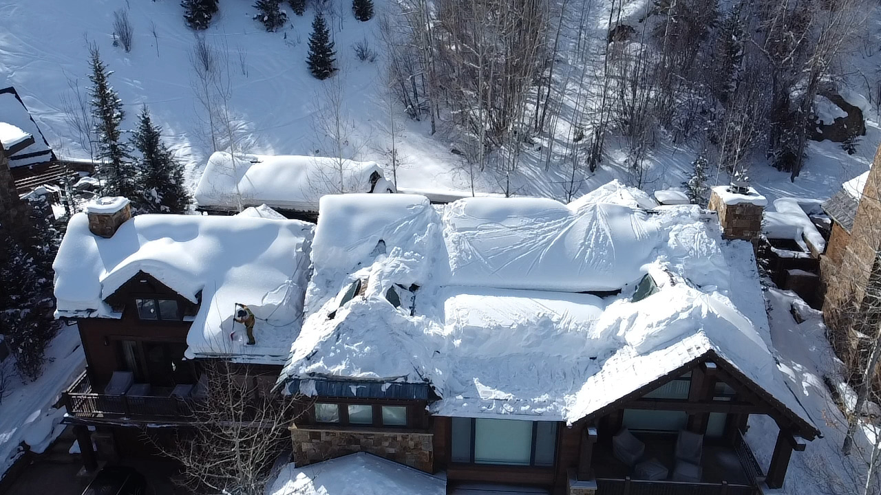 Waether-proof your roof - snow covered roof in aspen, snow removal by Aspen Roofing Contractors